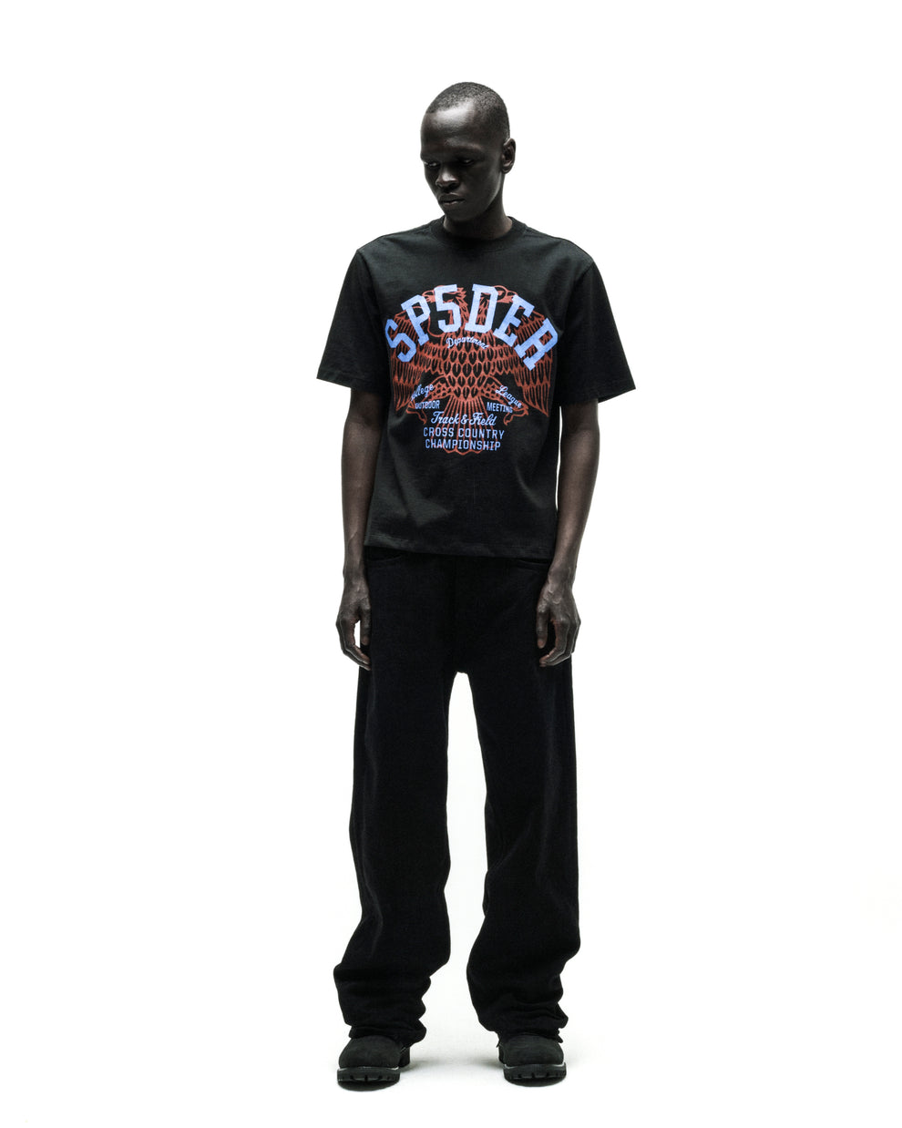 Black cotton Champions League tee with a vibrant eagle graphic and "SP5DER" text.