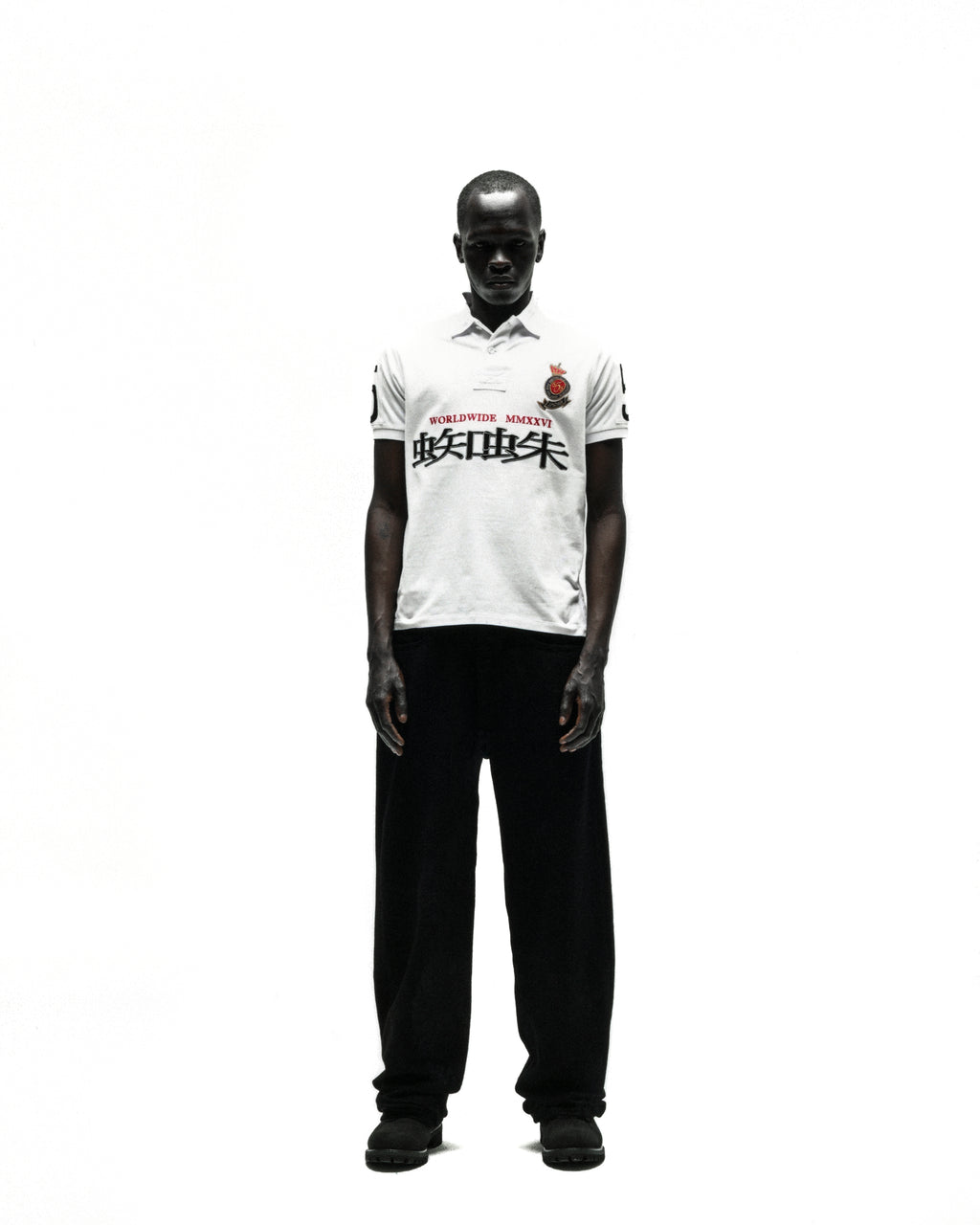 WORLDWIDE POLO white short-sleeve polo shirt with red rose crest and black text.