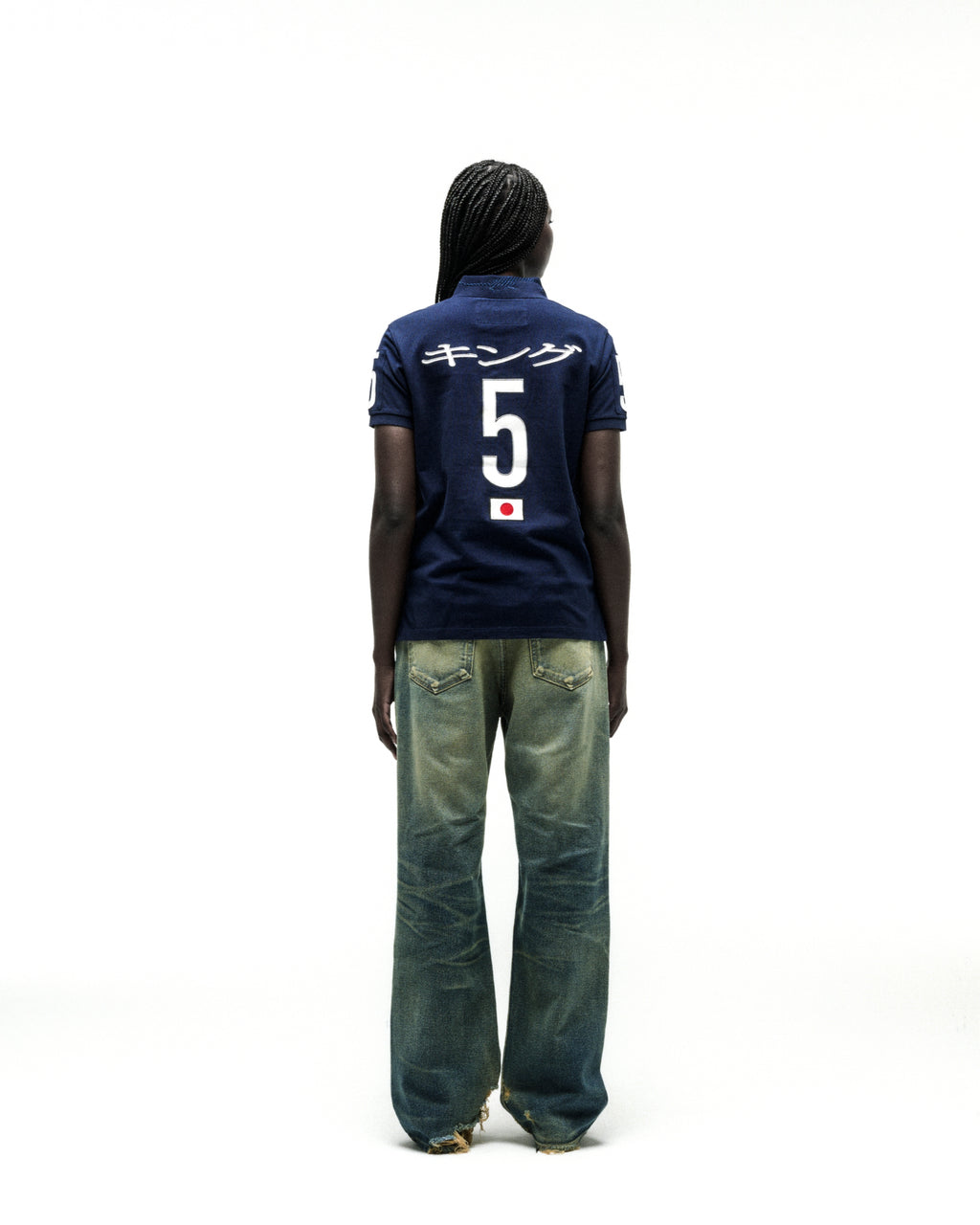Navy blue polo shirt with white Japanese text, large "5", and a Japanese flag emblem on the back.