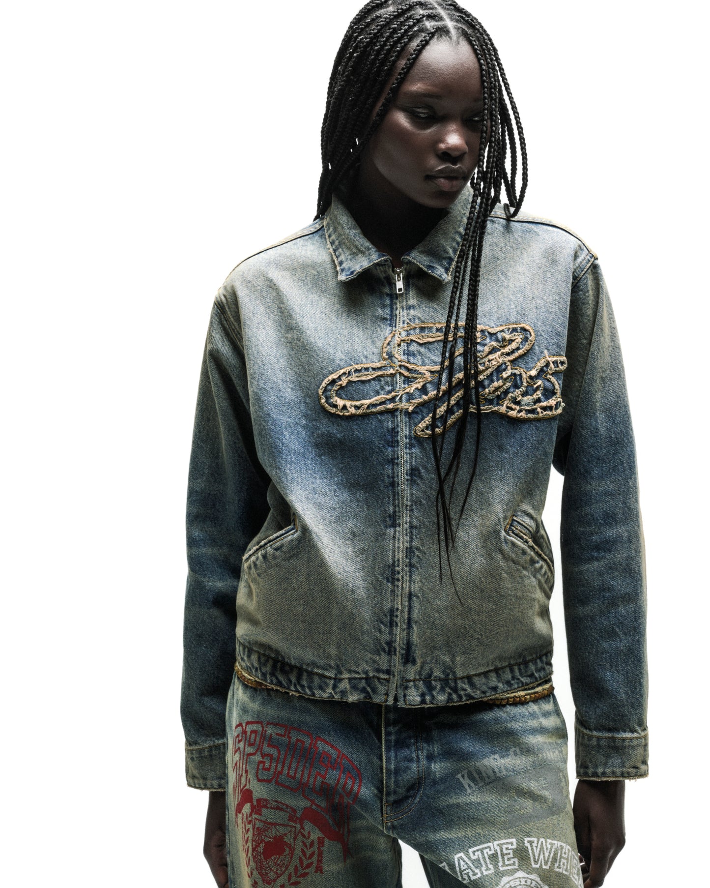 Washed blue denim work jacket with a gold chain script logo and full zipper.