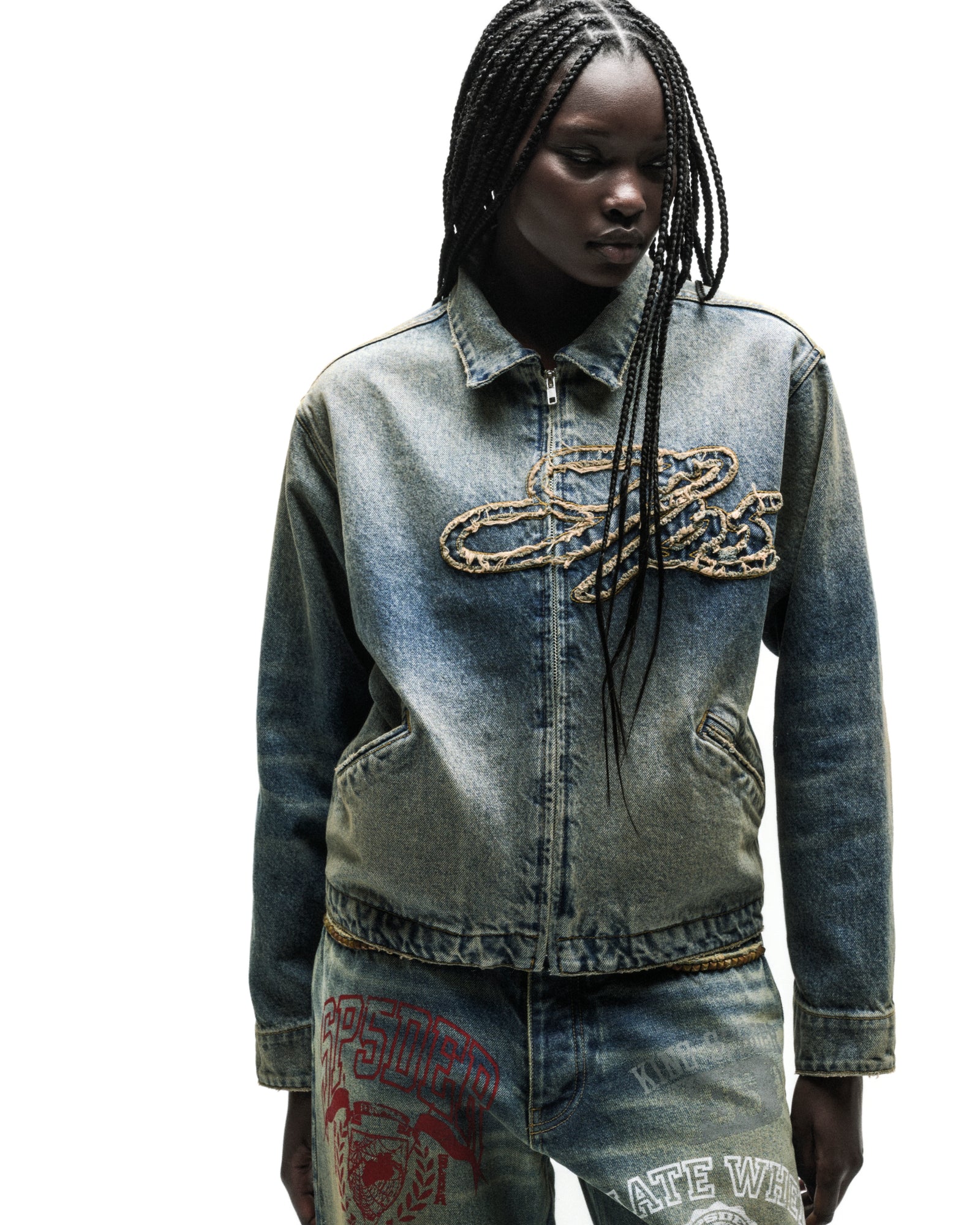 Washed blue denim work jacket with a gold chain script logo and full zipper.
