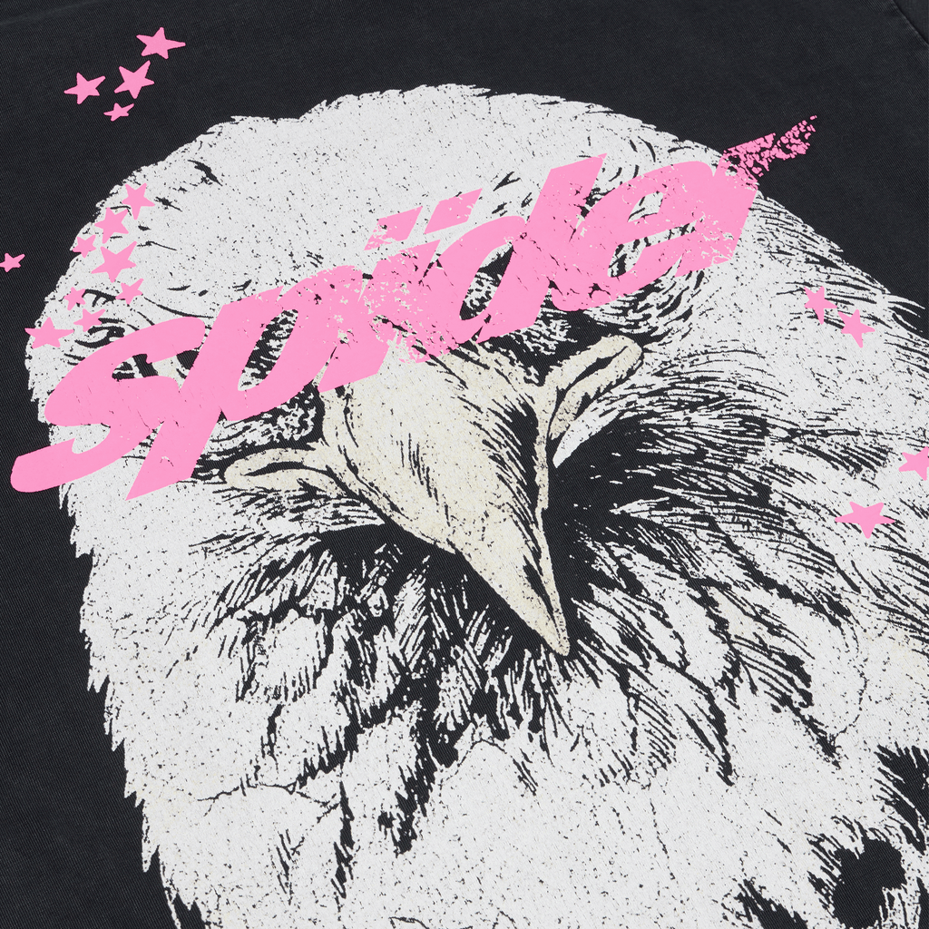 Black cotton tee with a white eagle graphic print and pink design accents.