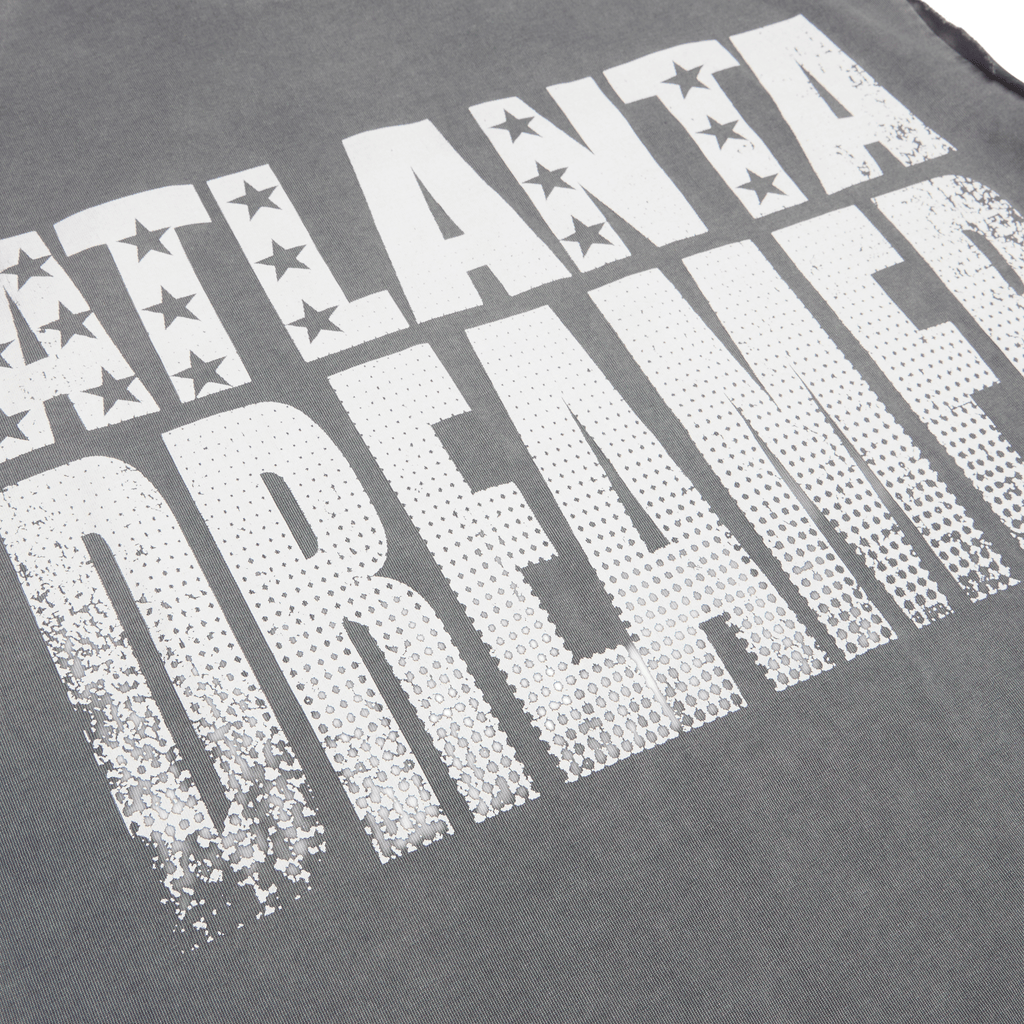 Gray vintage wash cotton tank with "ATLANTA DREAMER" graphic print and raw-cut armholes.
