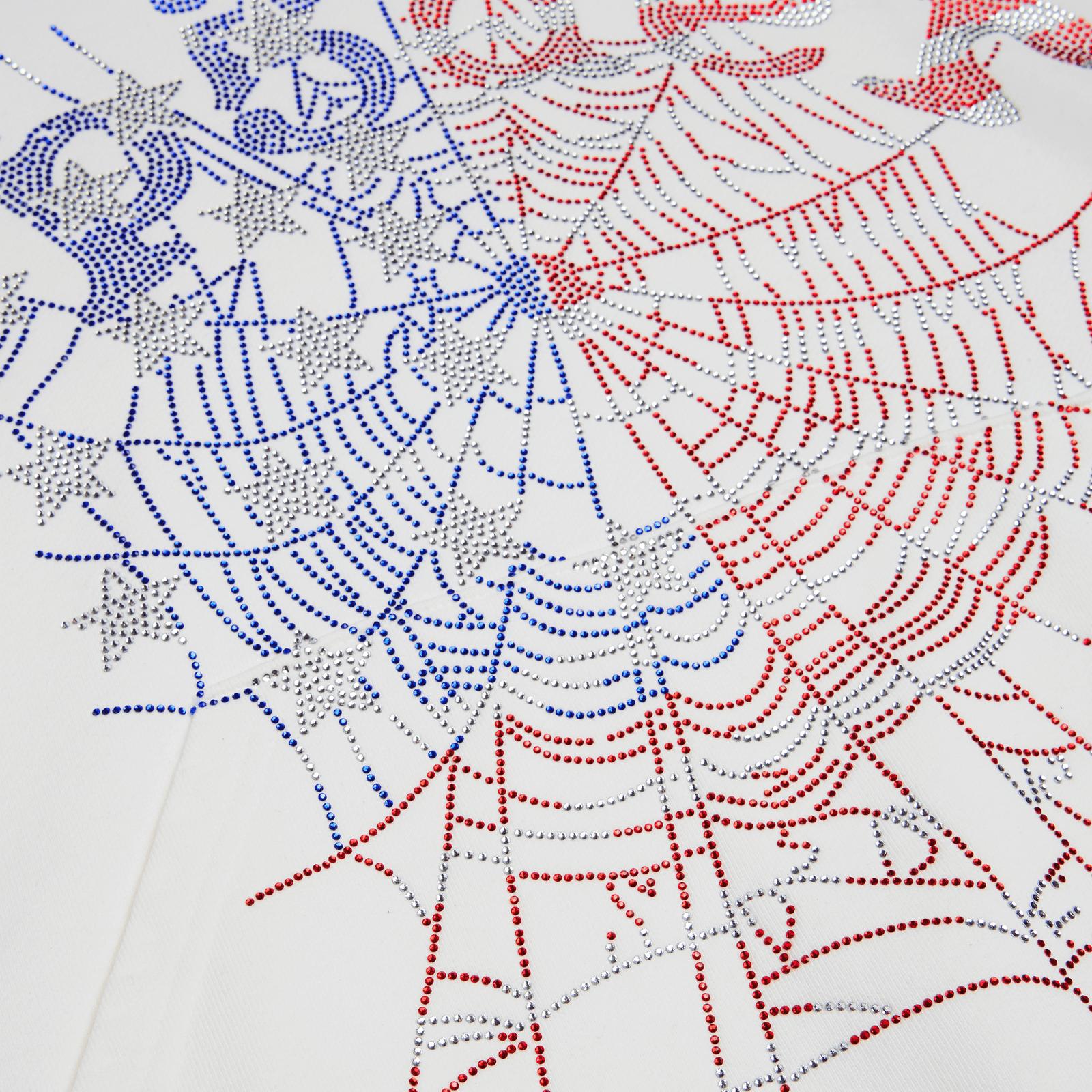 White cotton fleece sleeveless hoodie with red and blue rhinestone spider web graphic print.