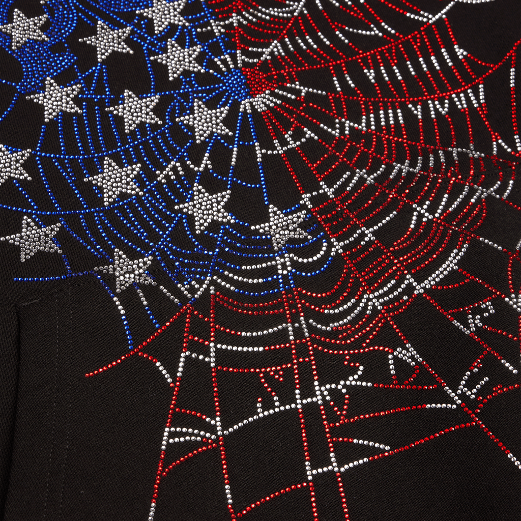 Black sleeveless hoodie with flag-inspired rhinestone OG web graphic, raw-cut armholes, and kangaroo pocket.