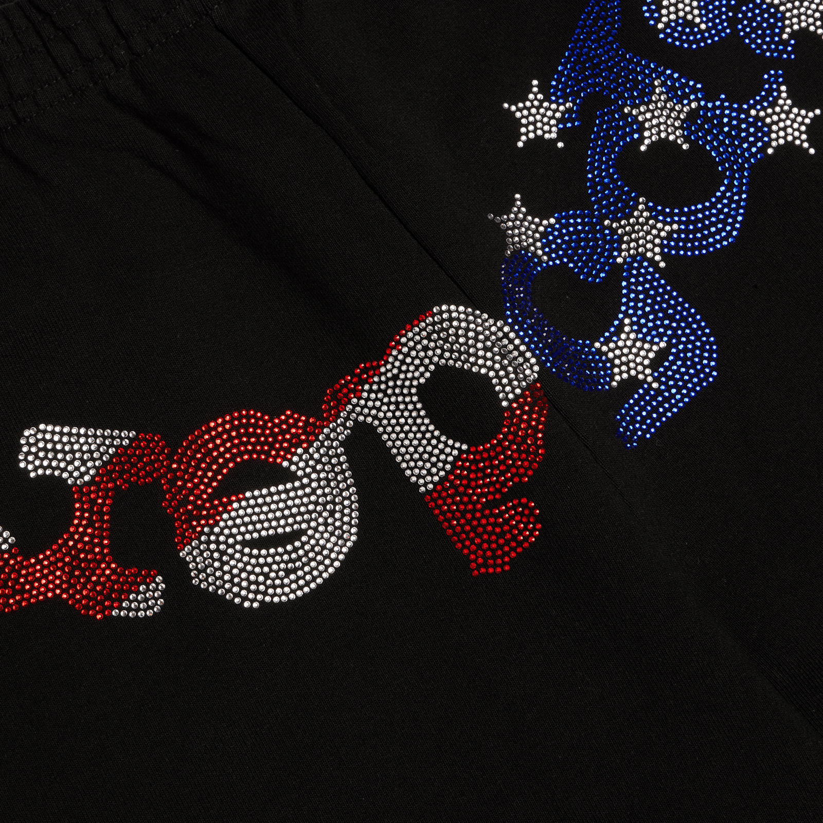Black cotton fleece sweatshorts with a flag-inspired rhinestone OG logo graphic.