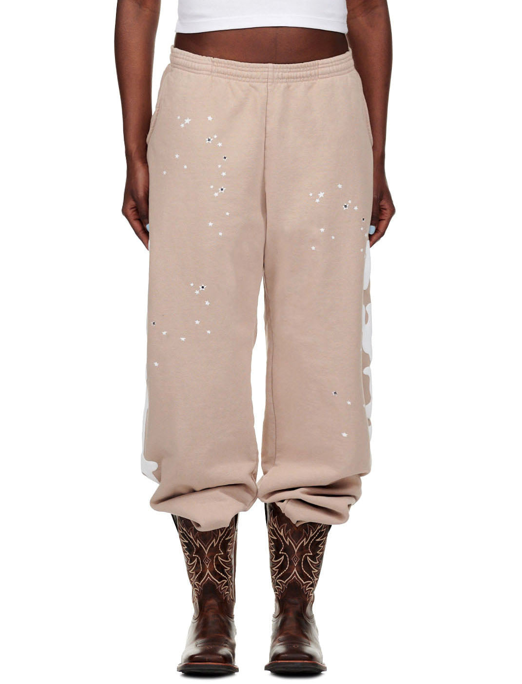 Sand Beluga Sweatpants, 23oz fleece, with white puff print stars and "Worldwide" text down legs.