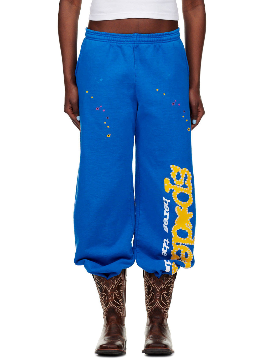 TC BLUE SWEATPANT, 23oz fleece, with yellow "SP5DER!" text and colorful star prints.