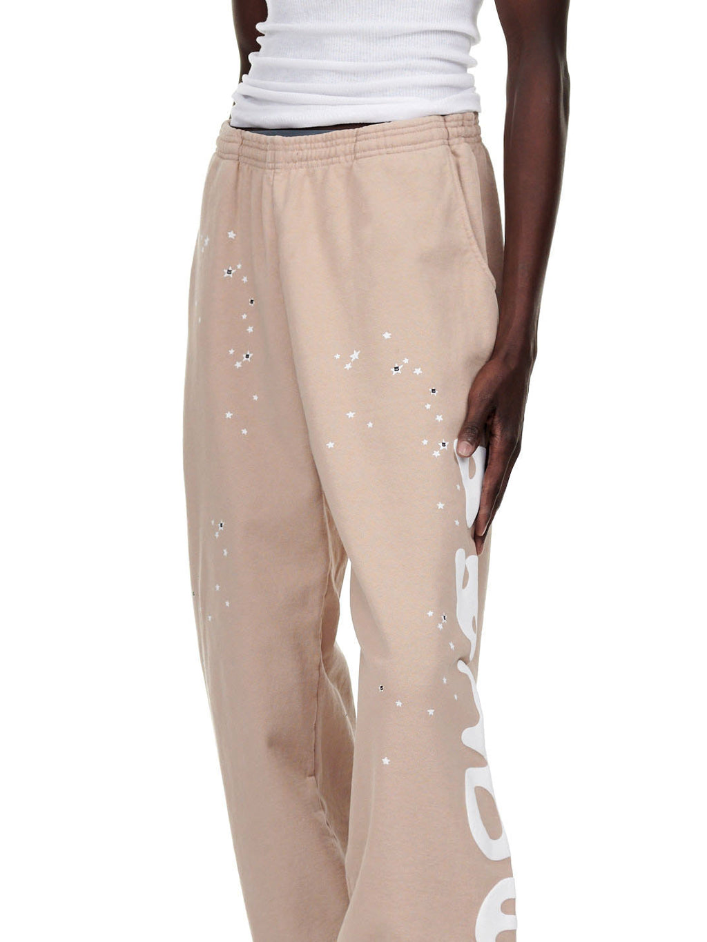 Sand Beluga Sweatpant, 23oz fleece, with white puff print stars and "Worldwide" text down the leg.