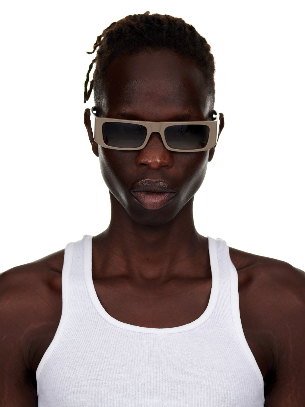 Man wearing SP5 x FLATLIST 'SLUG' sunglasses with handcrafted Mazzucchelli acetate frames and smoke brown gradient lenses.