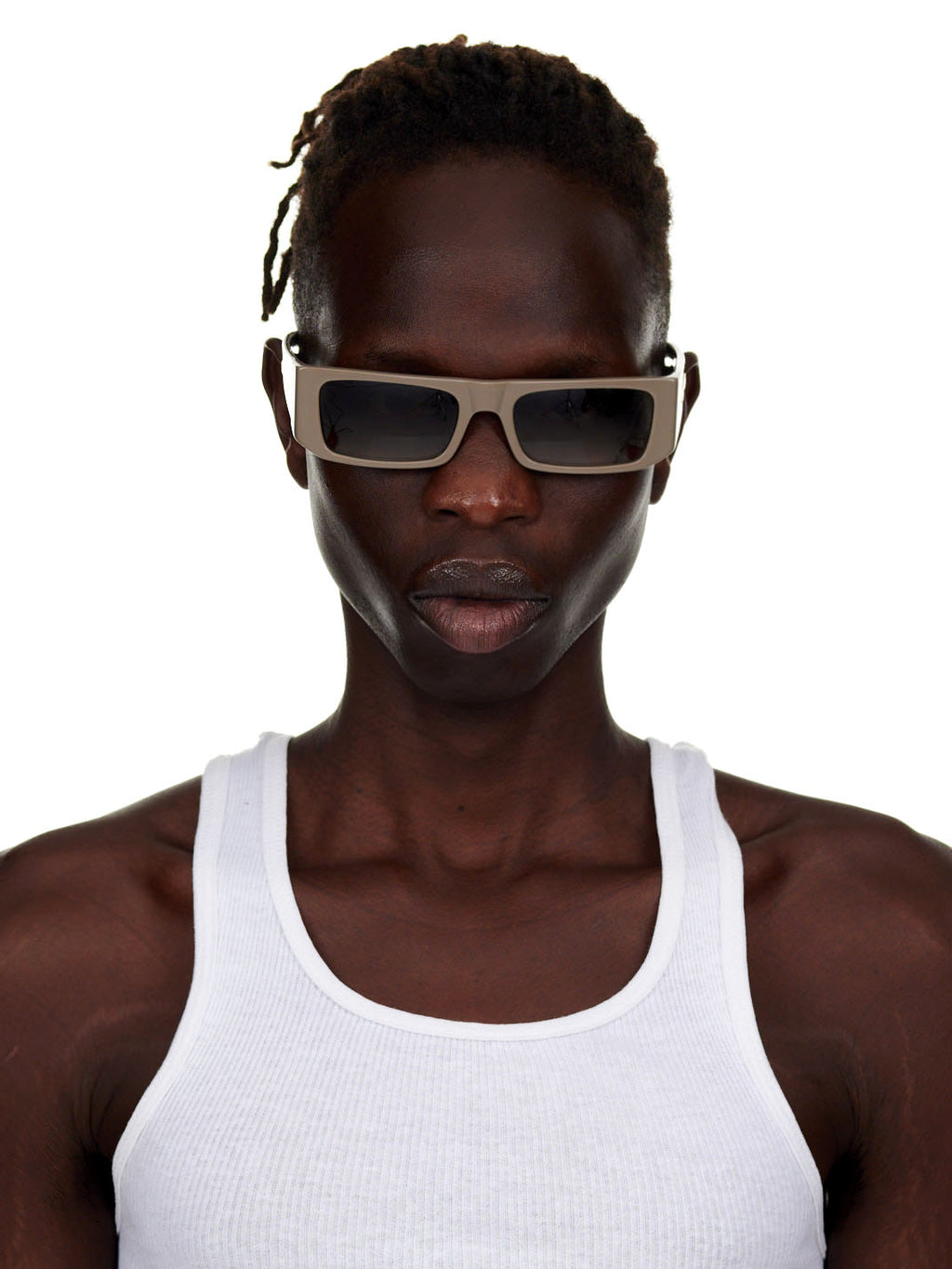 Man wearing SP5 x FLATLIST 'SLUG' sunglasses with handcrafted Mazzucchelli acetate frames and smoke brown gradient lenses.