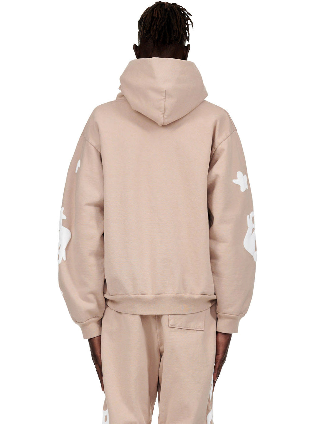 Back of a sand Beluga hoodie and matching sweatpants with white puff print designs.