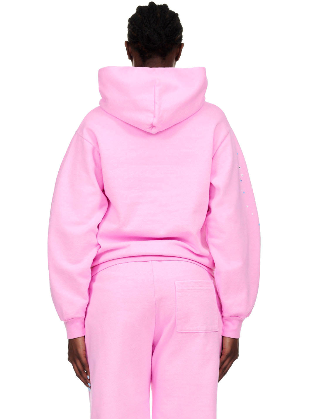 Back view of a person wearing an OG WEB PINK HOODIE and matching sweatpants.