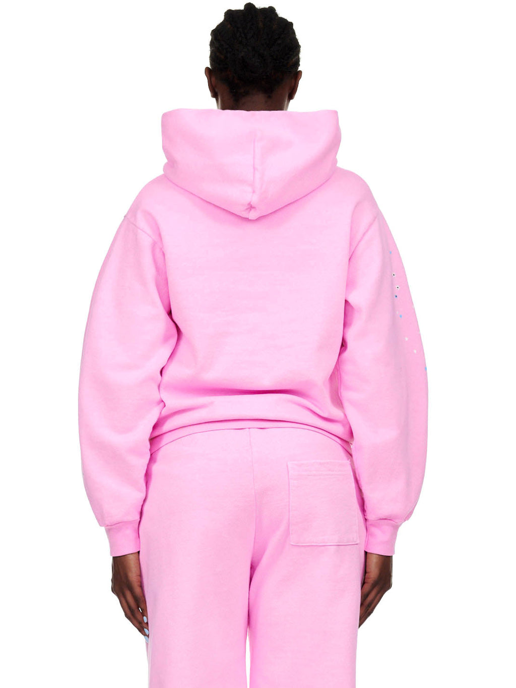 Back view of a person wearing an OG WEB PINK HOODIE and matching sweatpants.