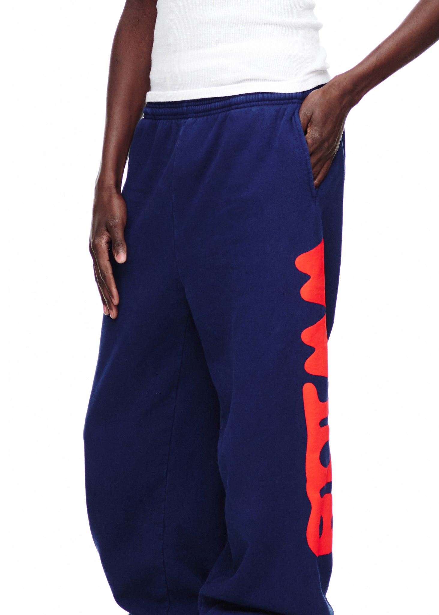 Navy blue BELUGA SWEATPANT with bold red "Worldwide" puff print down the leg.
