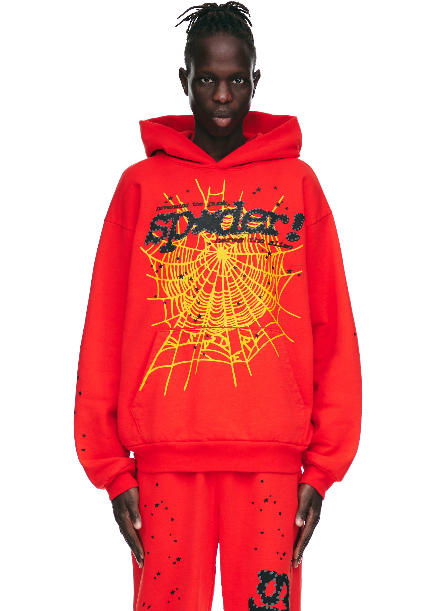 Red P*NK V2 hoodie with yellow spider web, black "SP5DER" text, and star prints.