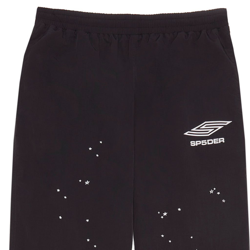 Black nylon ripstop SP5DER PRO wind pants with white logo and scattered star print.