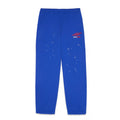 SP5DER PRO Wind Pant: Blue nylon ripstop with red logo, scattered white stars, and elastic cuffs.