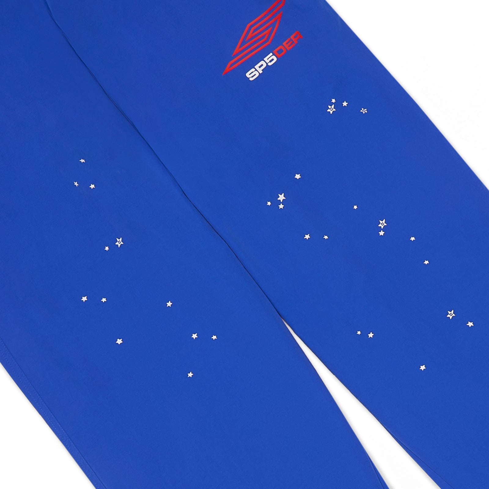 Blue nylon ripstop SP5DER PRO WIND PANT with red logo and scattered white star print.