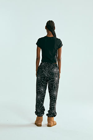 BLACK EMBROIDERED AOP SWEATPANT ON MODEL