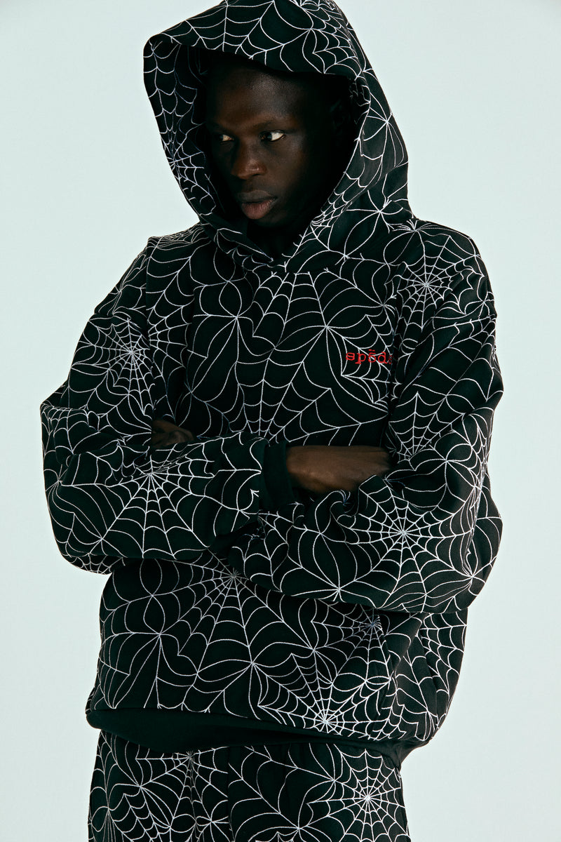 BLACK EMBROIDERED AOP HOODIE ON MODEL