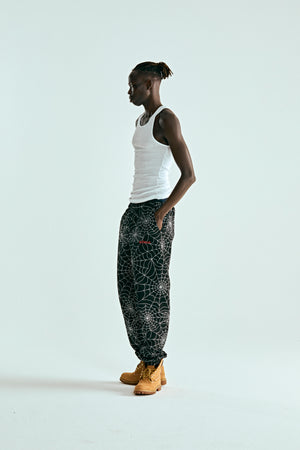 BLACK EMBROIDERED AOP SWEATPANT ON MODEL