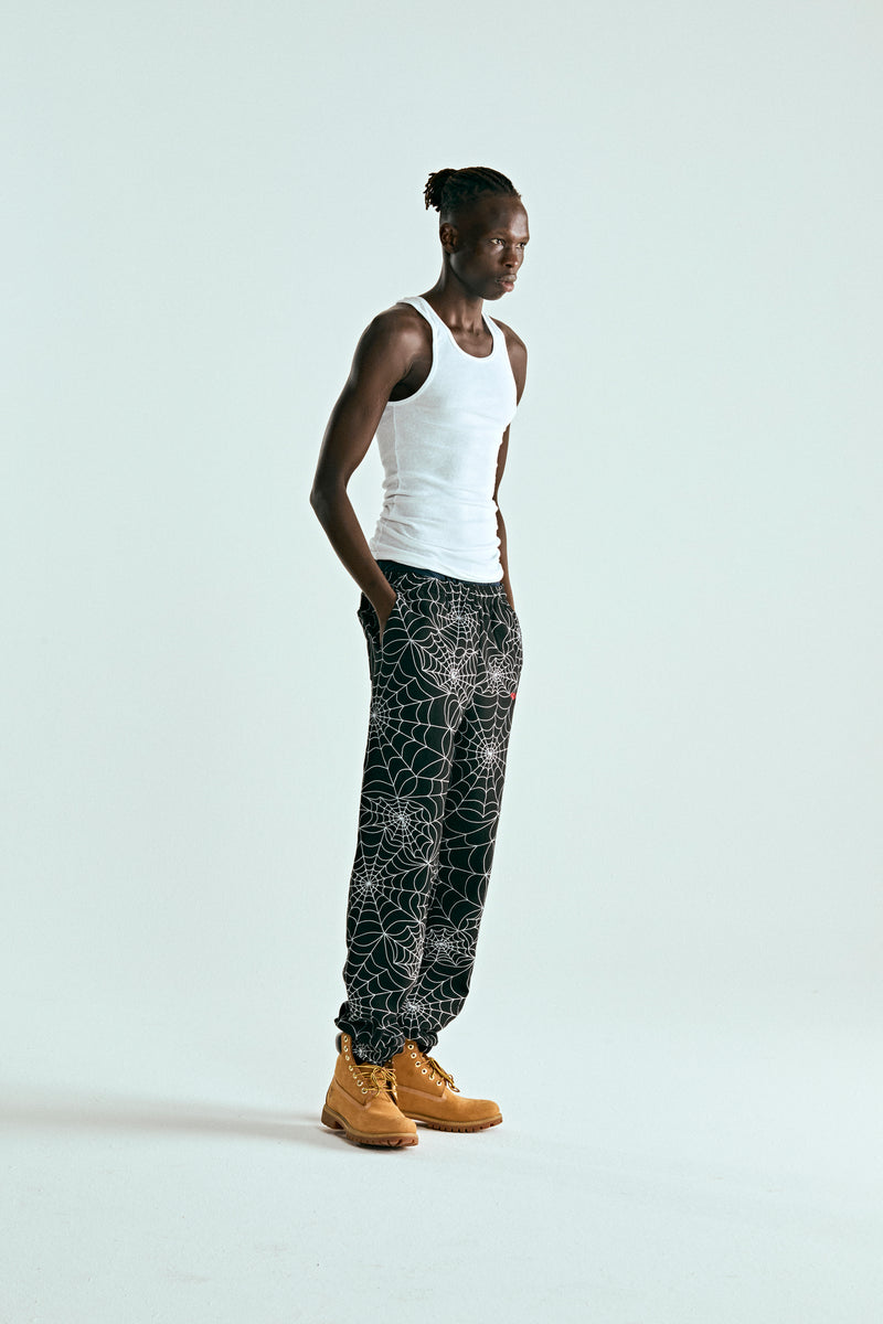 BLACK EMBROIDERED AOP SWEATPANT ON MODEL