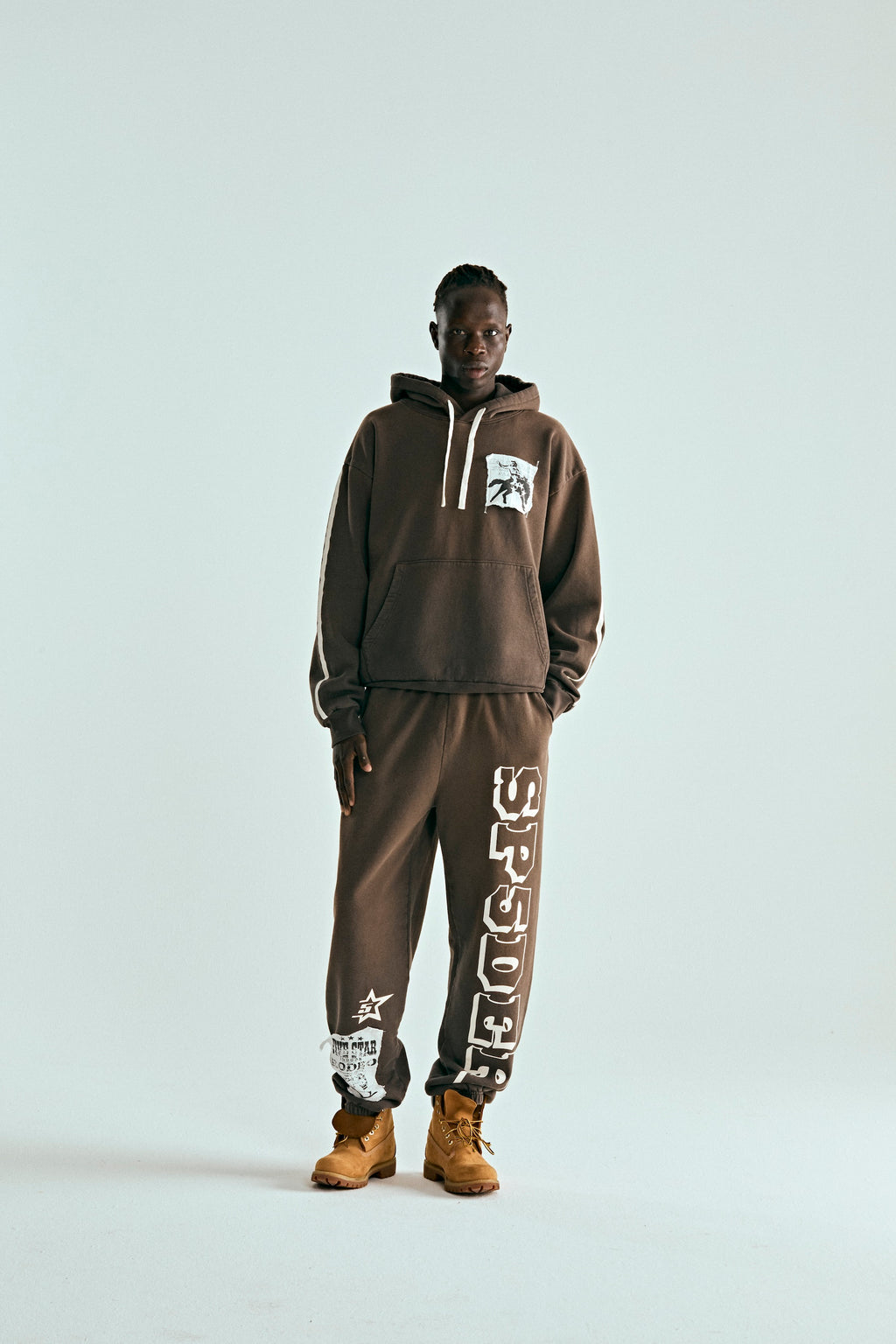 Brown 5STAR Rodeo hoodie and sweatpants set with distressed patch, drawstrings, and kangaroo pocket.