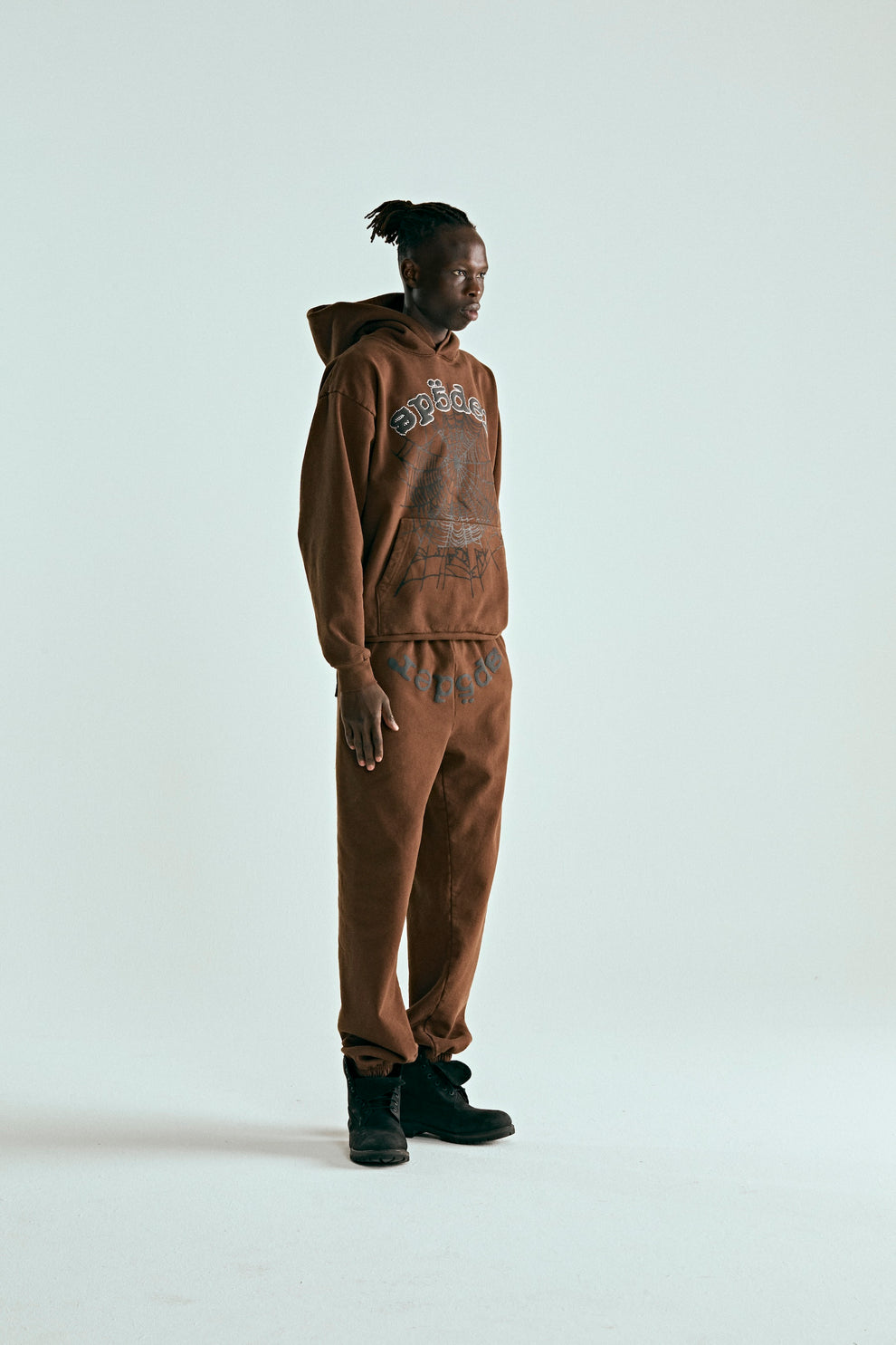 Brown cotton fleece hoodie and sweatpants set with rhinestone web and "SP5DER" text.