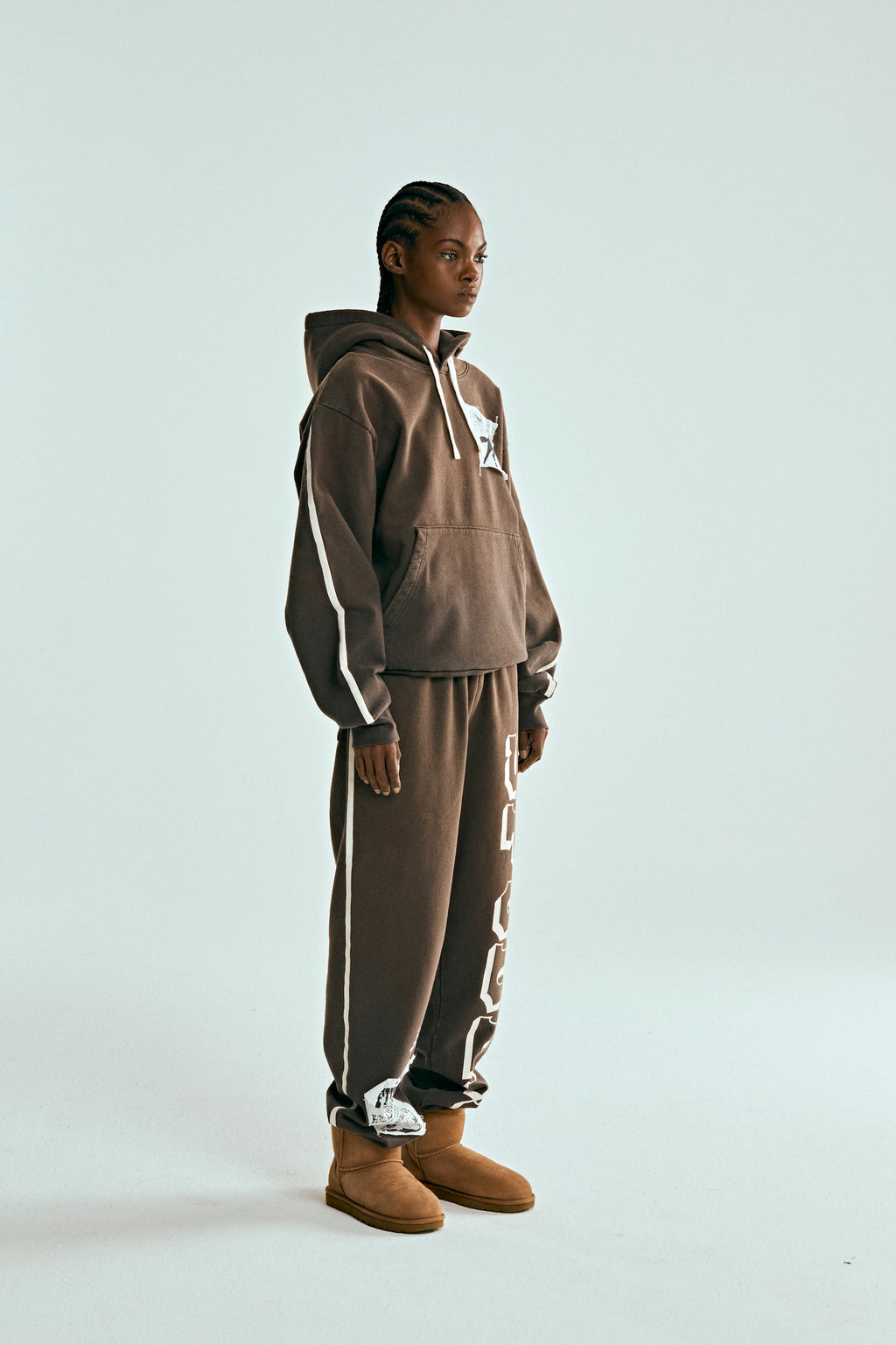 Brown 5STAR Rodeo hoodie and sweatpants set with white distressed patch, drawstring, and stripe details.