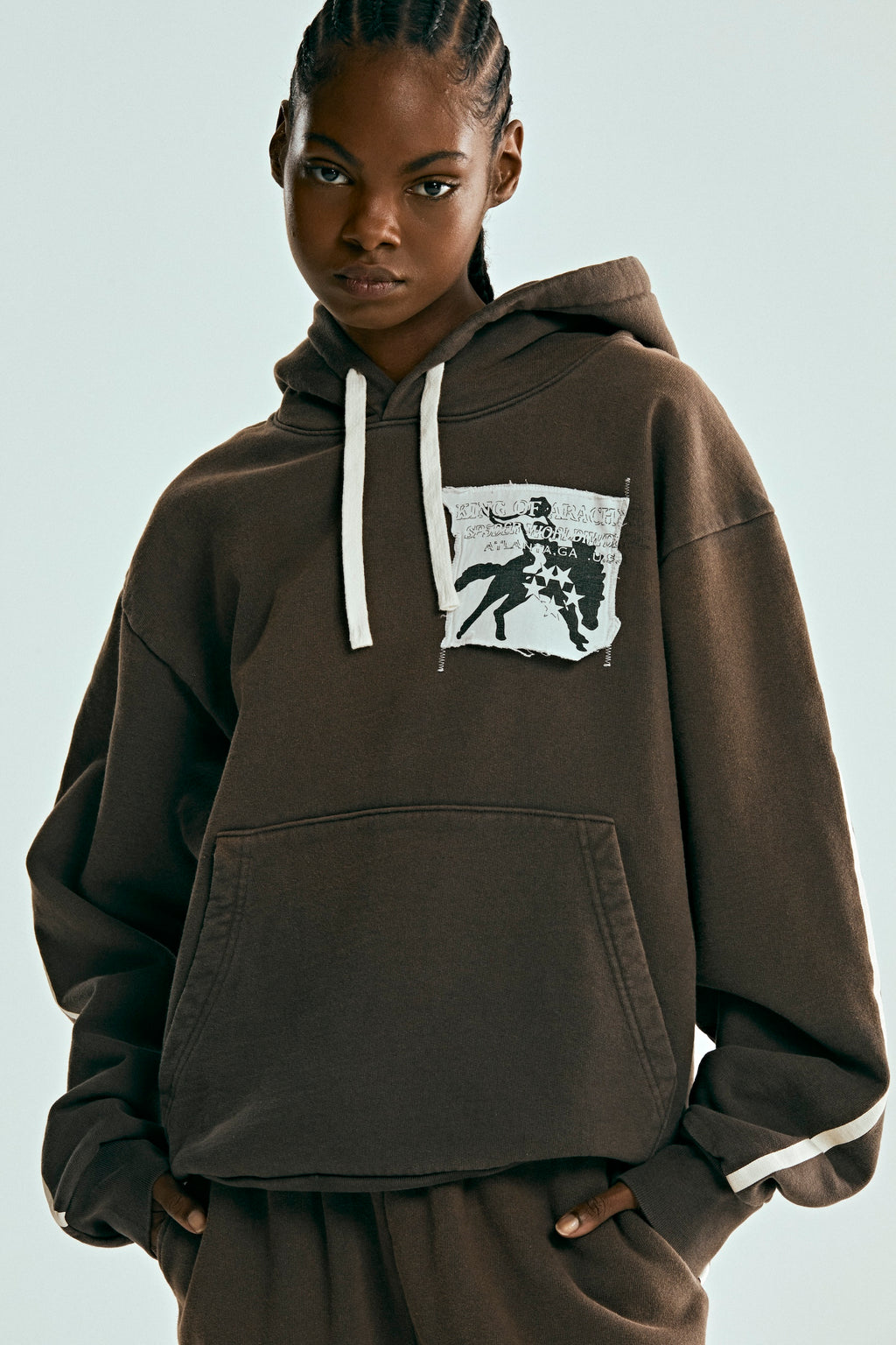 Brown 5STAR Rodeo distressed patch hoodie with white drawstrings and kangaroo pocket.