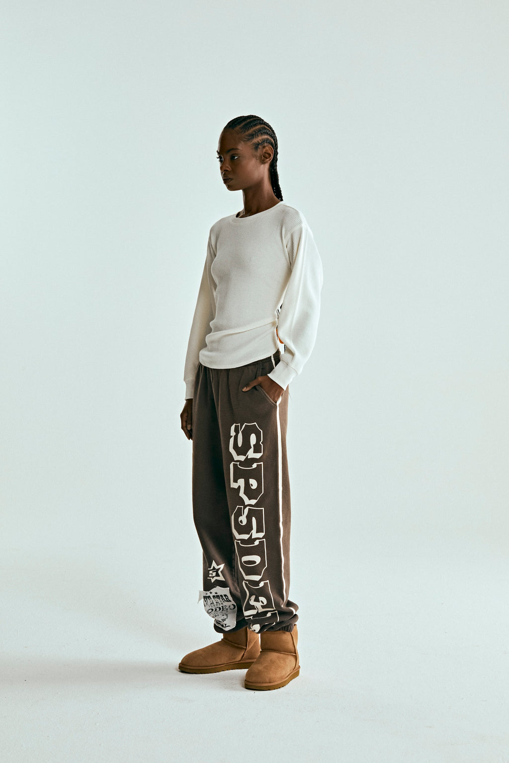 Brown 5STAR RODEO SWEATPANT with SP5DER text, side stripe, and distressed patch.