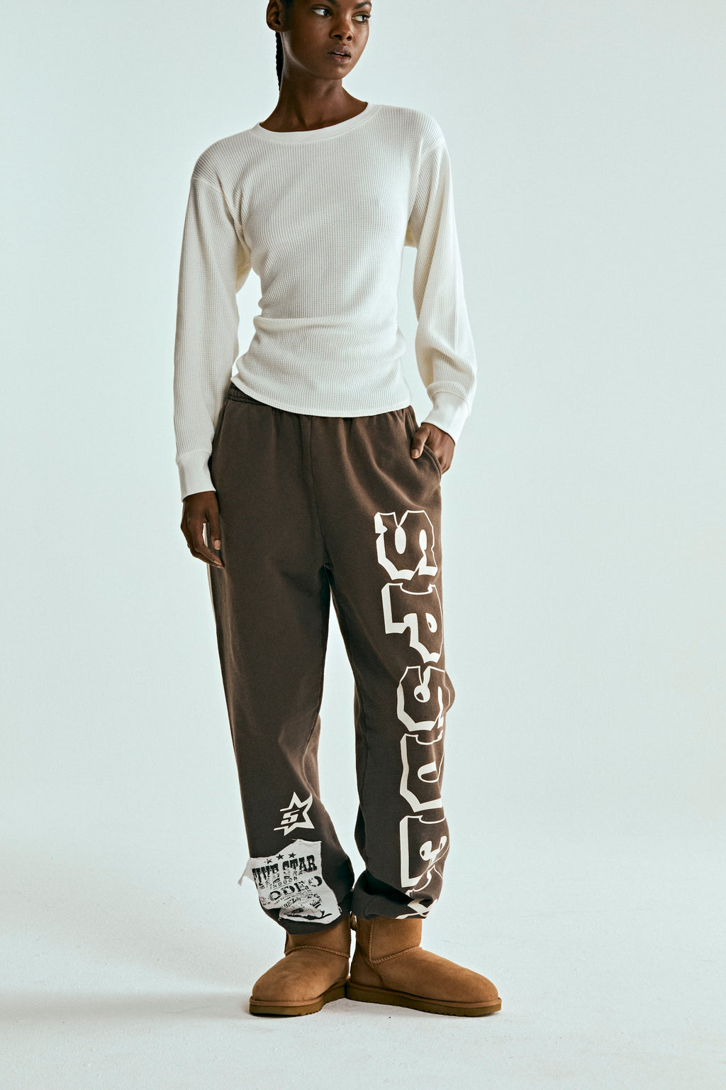 Brown 5STAR RODEO SWEATPANT with white SP5DER text, distressed patch, and side stripe.