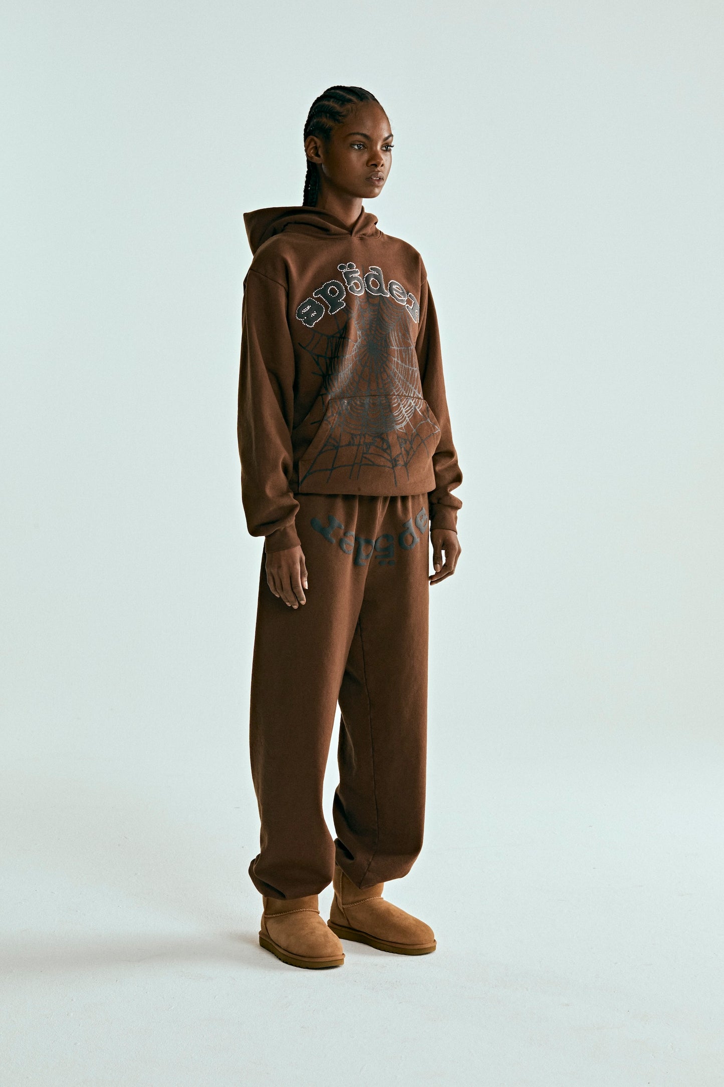 Brown OG WEB HOODIE and sweatpants set with rhinestone SP5DER text and web print.