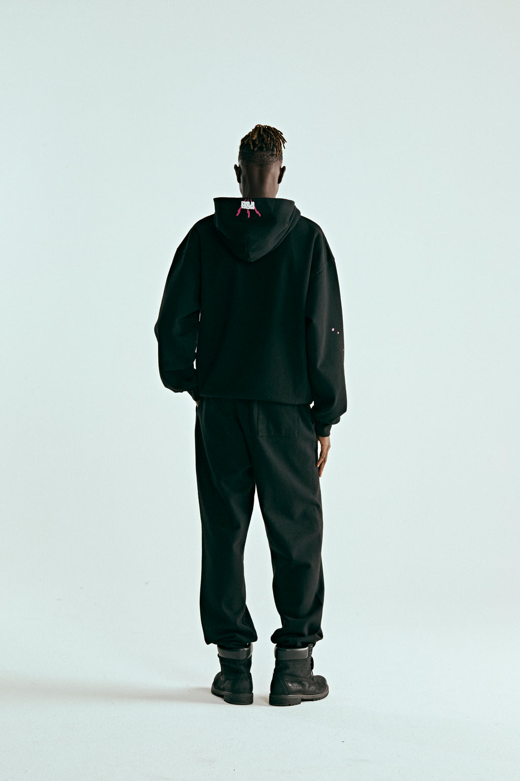 BLACK ANGEL NUMBER HOODIE ON MODEL