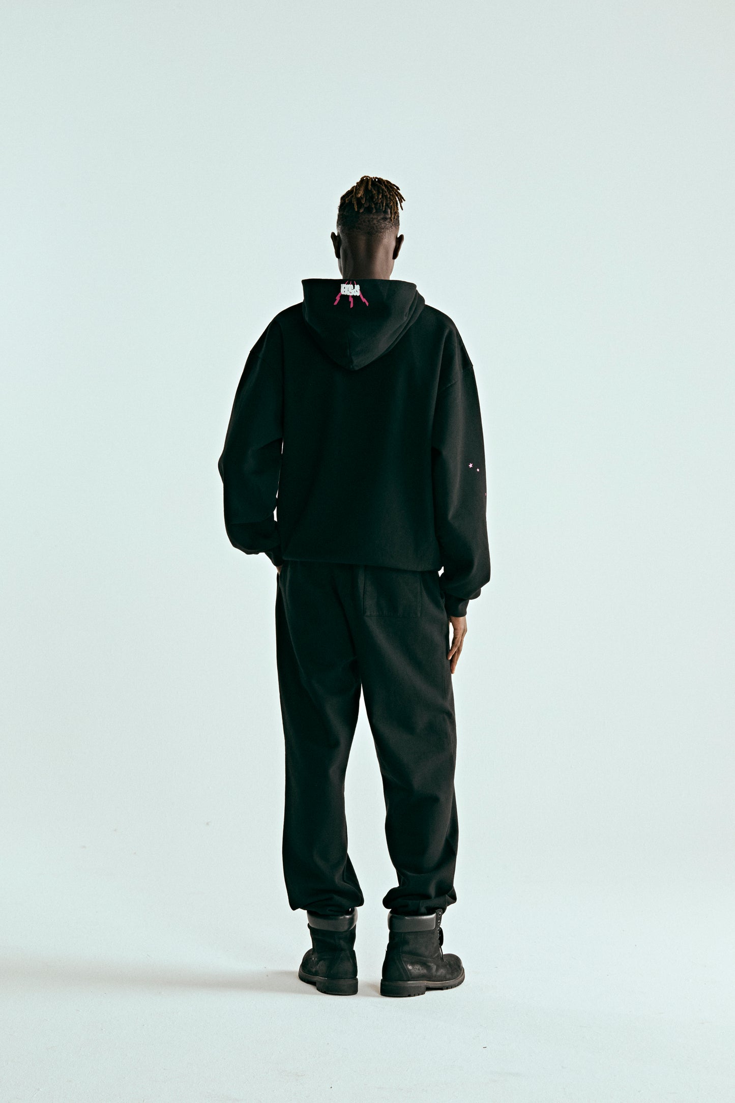 BLACK ANGEL NUMBER HOODIE ON MODEL