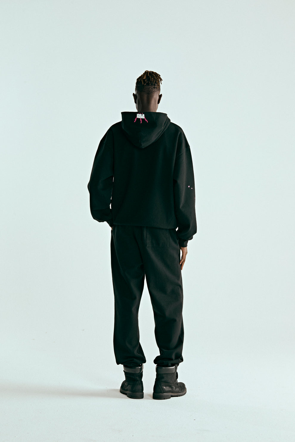 BLACK ANGEL NUMBER HOODIE ON MODEL