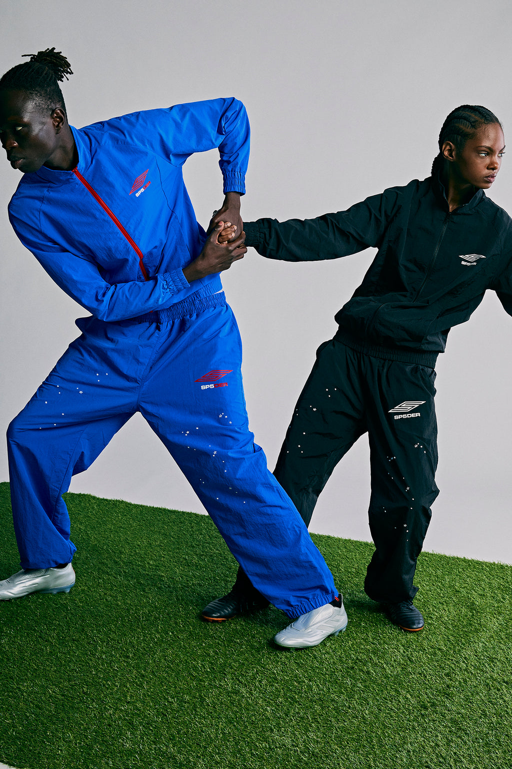 SP5DER PRO WIND PANT: Blue nylon ripstop wind pants with logo, star print, and zip cuffs.