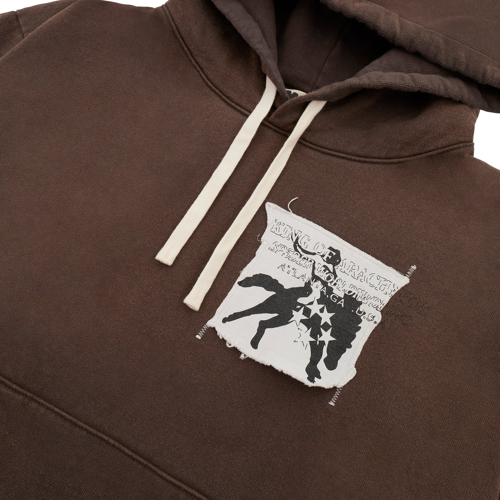 Brown 5STAR Rodeo hoodie with distressed patch, white drawstrings, and kangaroo pocket.