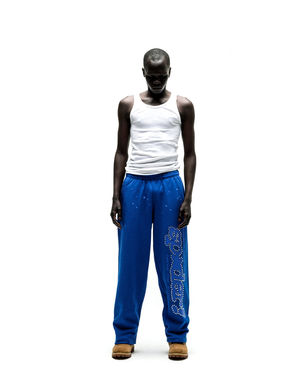 Blue cotton fleece sweatpants with "P*NK SP5DER" text and scattered stars in rhinestones.
