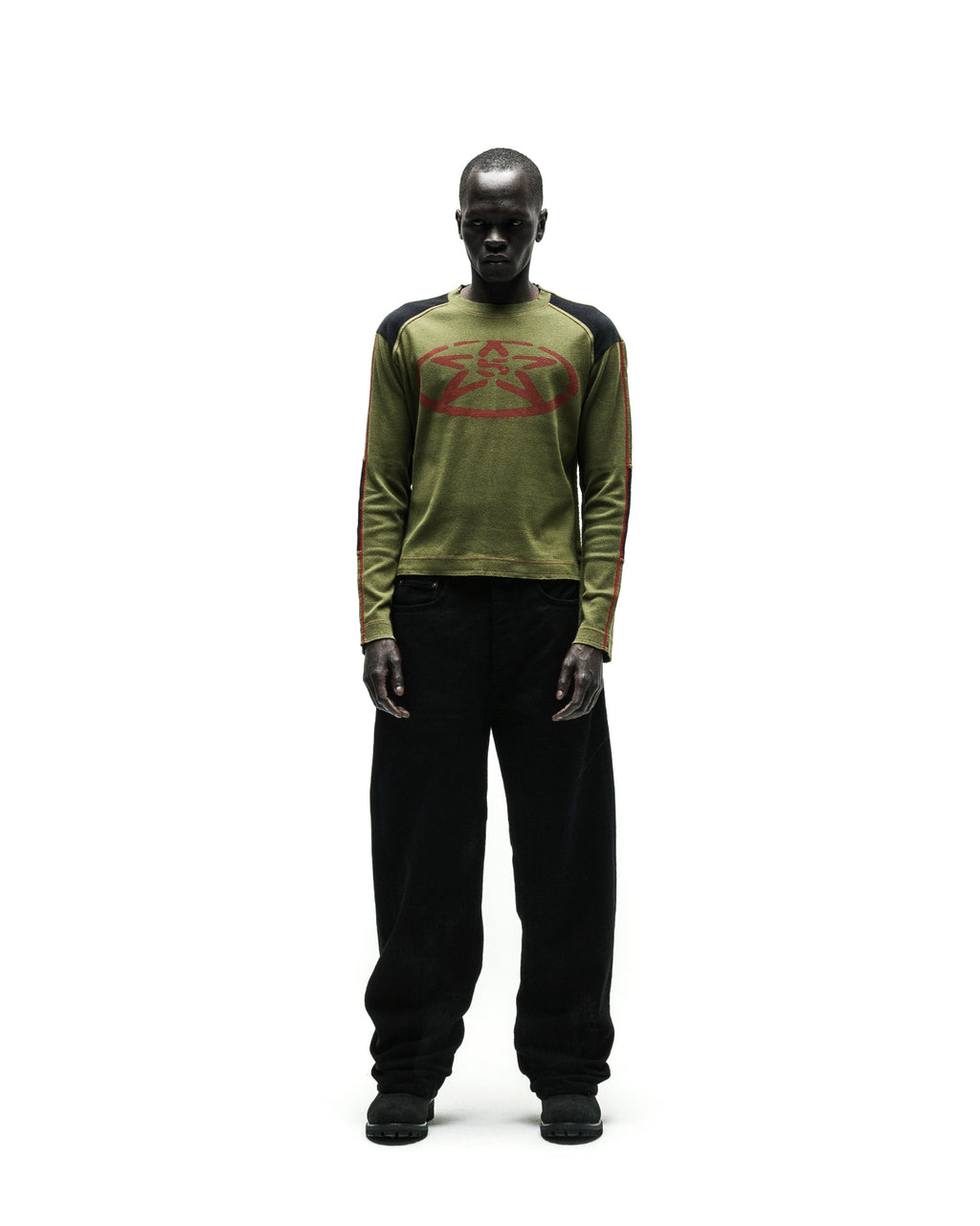 SERVICE LONGSLEEVE in olive green with red star graphic, black shoulders, and striped sleeves.