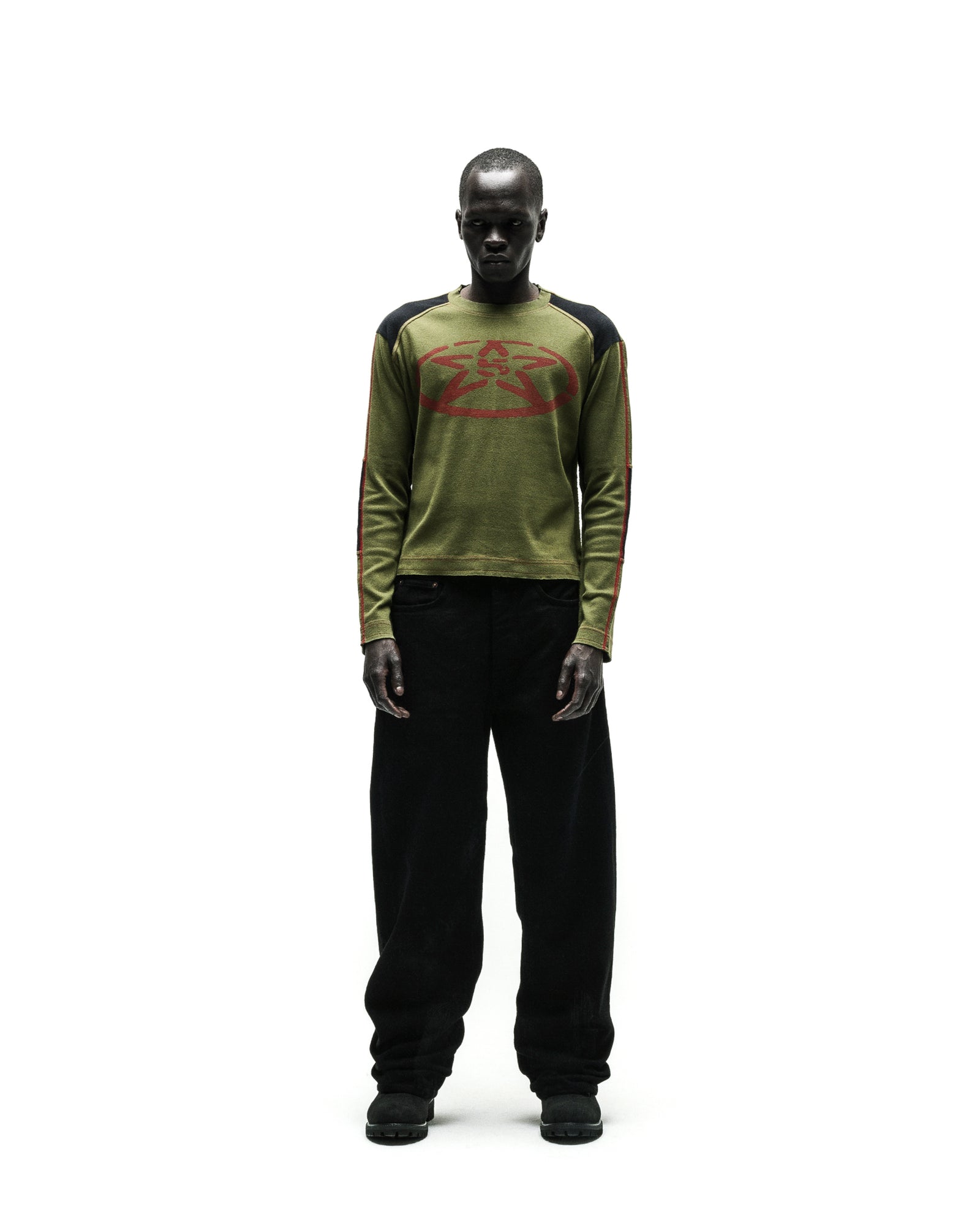 SERVICE LONGSLEEVE in olive green with red star graphic, black shoulders, and striped sleeves.