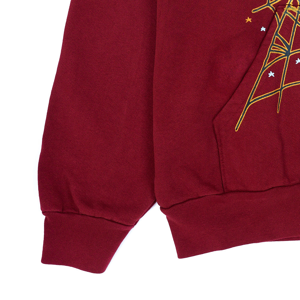 Red SP5DER HOODIE with yellow web print, 23oz fleece, ribbed cuffs and hem.