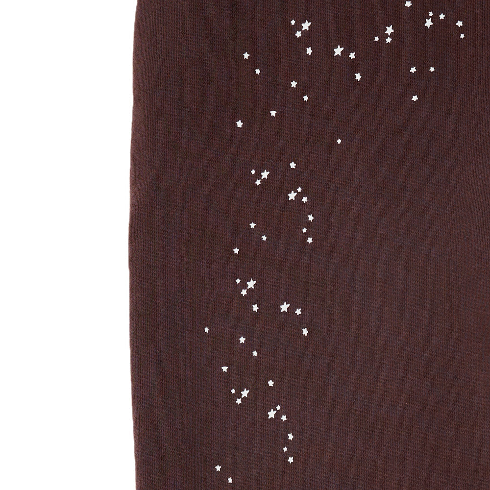 Brown fleece sweatpant with scattered white star puff prints.