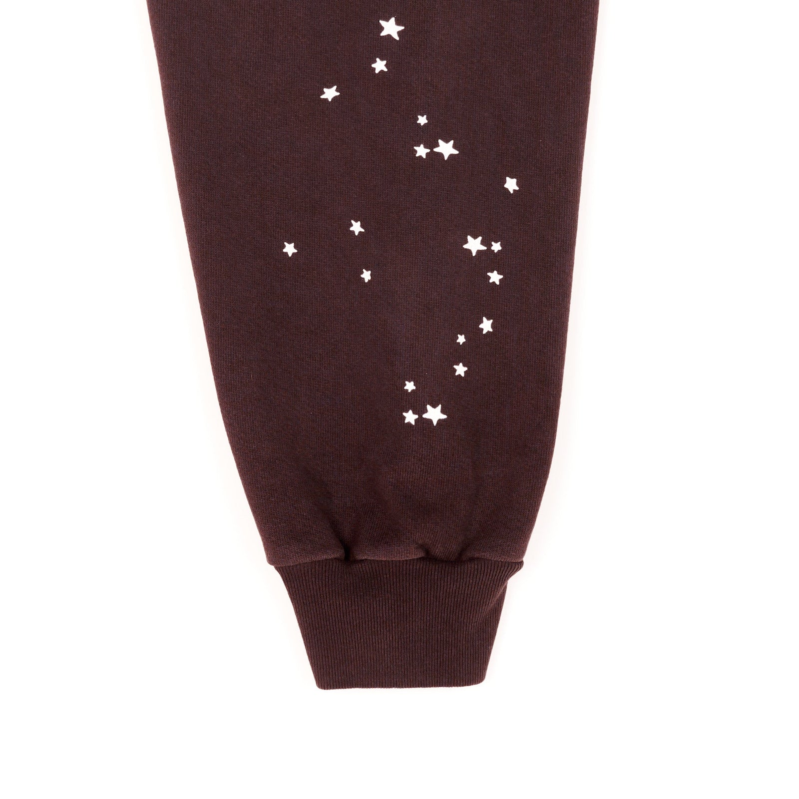 Brown fleece hoodie sleeve with white star print.