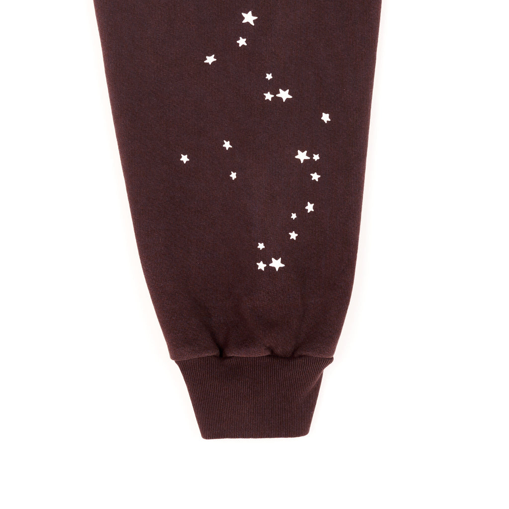 Brown fleece hoodie sleeve with white star print.