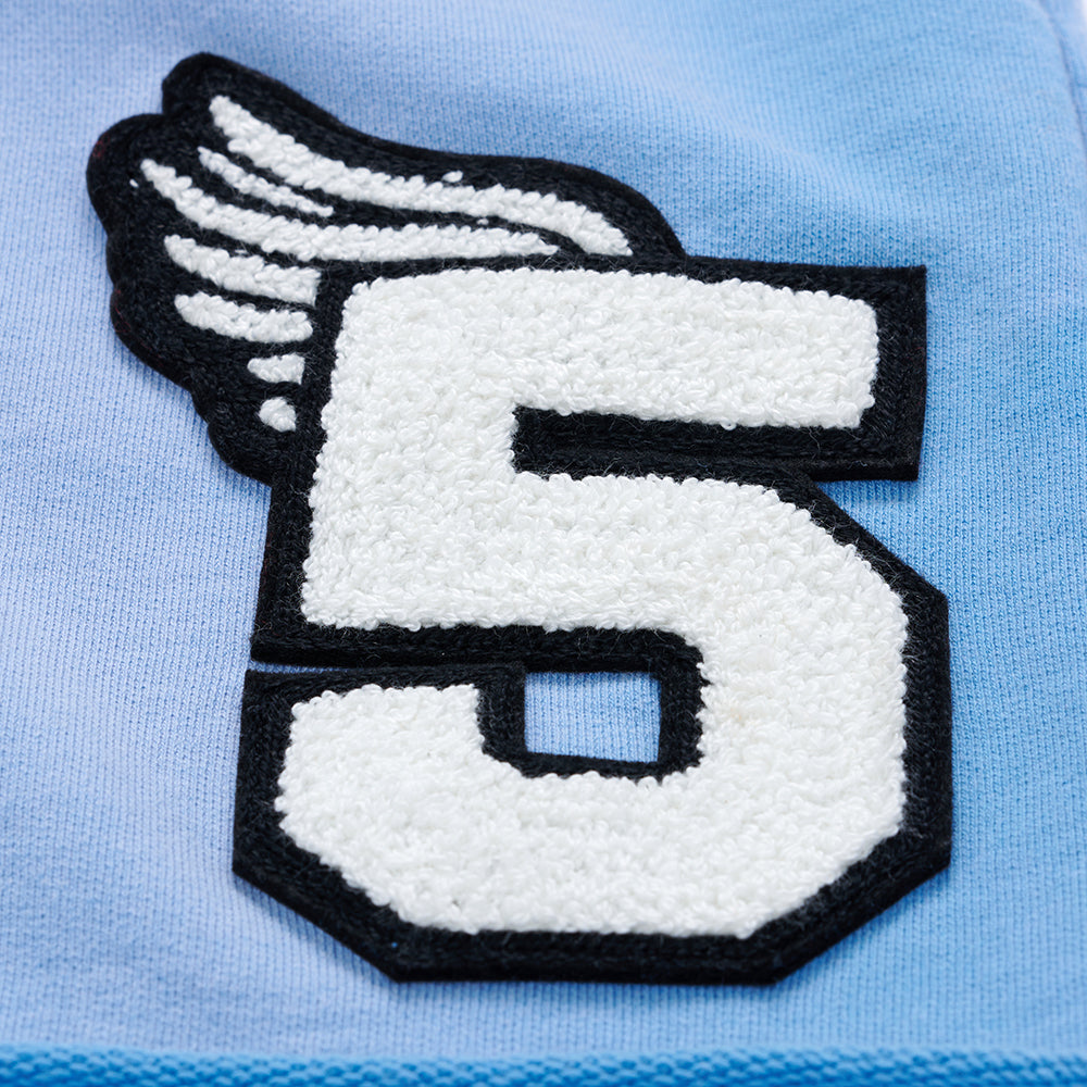 Light blue French terry sweatshort with a white chenille "5" patch and black winged outline.