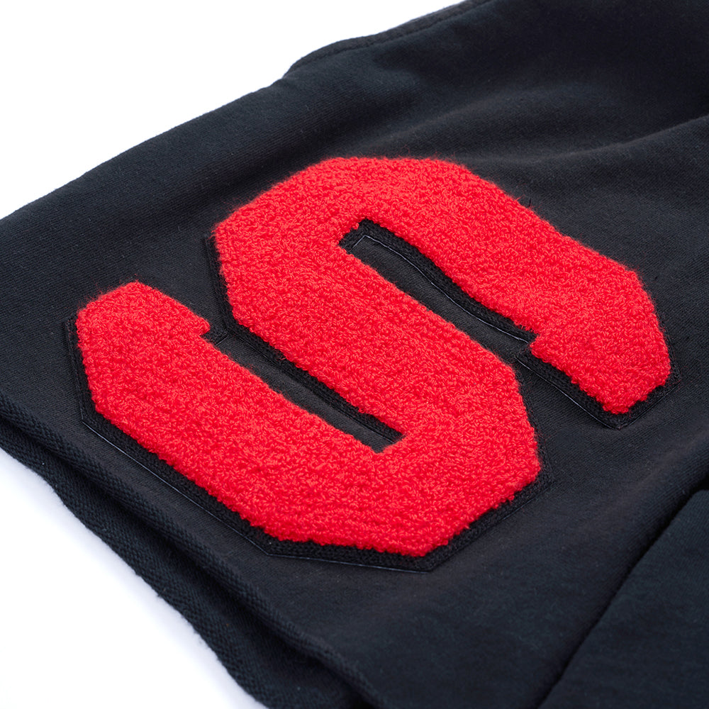 Black French terry CUT SWEATSHORT with a large red chenille "S" patch.