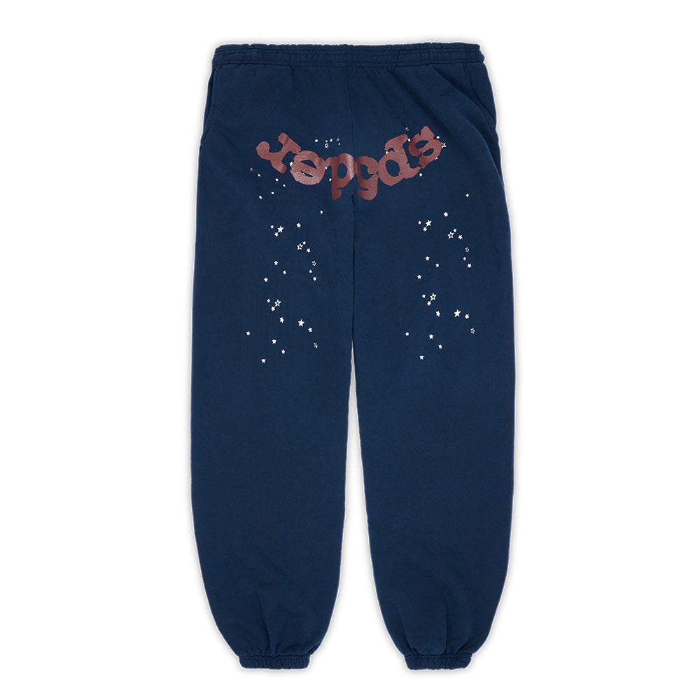 Navy adult sweatpants with "spider" puff print, white star discharge print, and custom racing patch.
