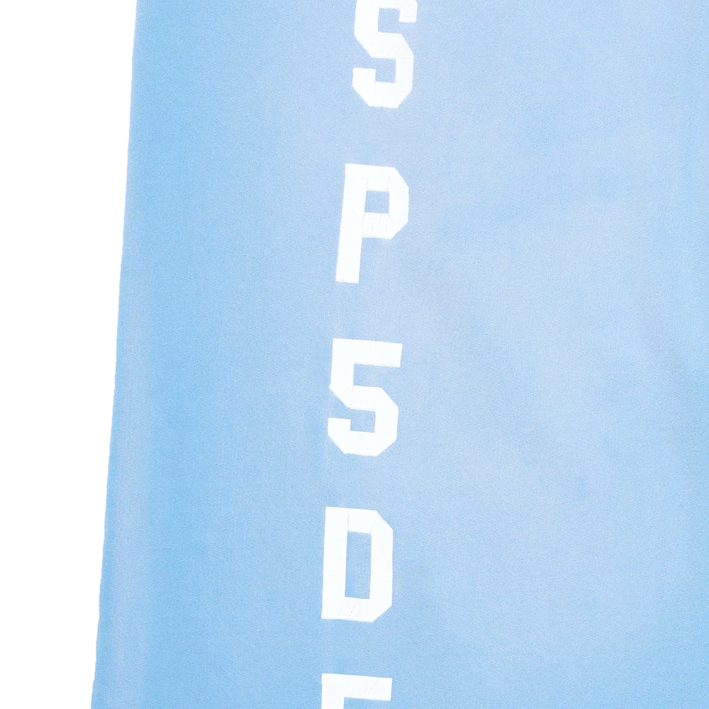 Light blue JUMBO SWEATPANT with white SP5DER embroidery down the leg.